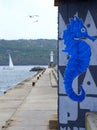 Blue seahorse graffiti on breakwater Royalty Free Stock Photo