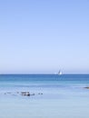 Blue seascape with sailboat on the horizon Royalty Free Stock Photo