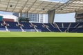 Blue Seatings, Green Pitch and Gallery inside Empty Stadium Before Soccer Match