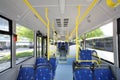 Blue seats inside saloon of empty city bus Royalty Free Stock Photo