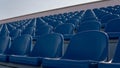Bleachers in a sports stadium. Blue Seats In A Row Royalty Free Stock Photo
