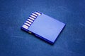 Blue Secure Digital Memory Card Back side of digital media with contact tracks Isolated blue background Full size Secure Digital Royalty Free Stock Photo