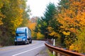 Blue semi truck on winding highway in autumn Columbia Gorge Royalty Free Stock Photo