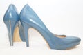 Blue sexy high-heeled shoes isolated on a white carpet. Royalty Free Stock Photo