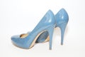 Blue sexy high-heeled shoes isolated on a white carpet. Royalty Free Stock Photo