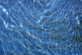 Blue shallow water wavy reflection on beach Royalty Free Stock Photo