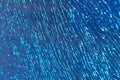 Blue shattered glass completely covered with cracks, creating a fragmented, textured surface with sharp patterns and a dramatic Royalty Free Stock Photo