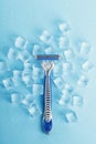 Blue shaving machine with sharp blades on the background of ice cubes close-up Royalty Free Stock Photo