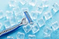 Blue shaving machine with sharp blades on the background of ice cubes close-up Royalty Free Stock Photo