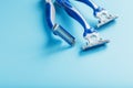 Blue shaving machines in a row on a blue background with ice cubes Royalty Free Stock Photo