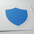 A blue shield emblem centered on a gray background. The shield has a smooth, glossy Royalty Free Stock Photo