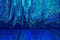 Blue, shiny, draped fabric