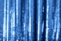 Blue shiny fabric with sequins, blured abstract background. Festive holiday concept Royalty Free Stock Photo