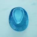 Blue shiny sequined party Hat over wooden background. Purim celebration concept & x28;jewish carnival holiday& x29;