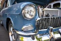 Blue shiny vintage retro car with open hood at a street seasonal exhibition Royalty Free Stock Photo