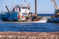 blue ship in dredging port Royalty Free Stock Photo