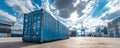 Blue shipping container on concrete ground with stacked containers and crane under cloudy sky Royalty Free Stock Photo