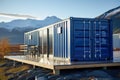 Blue shipping container near beautiful mountains.Great for outdoor experiences and wildlife