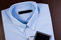Blue shirt with black blank price tag. Royalty Free Stock Photo