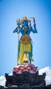 Blue shiva statue under a blue sky Royalty Free Stock Photo