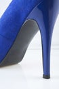 Blue shoe against white background