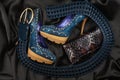 Blue shoes and belt, purse lying on black satin Royalty Free Stock Photo