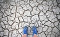 Blue shoes on a dry lake bed (selfie) Royalty Free Stock Photo