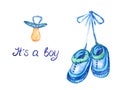 Blue shoes hanging on lace and pacifier near, isolated with inscription it`s a boy