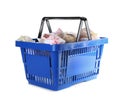 Blue shopping basket with different gifts on background Royalty Free Stock Photo