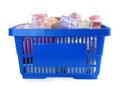 Blue shopping basket with different gifts on background Royalty Free Stock Photo