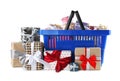 Blue shopping basket with different gifts on white Royalty Free Stock Photo