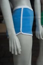 blue shorty on mannequin in a fashion store showroom