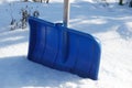 A blue shovel for snow removal Royalty Free Stock Photo