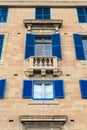 Blue shutter windows and balcony