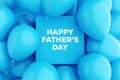 Blue sign frame with the message HAPPY FATHER'S DAY surrounded with blue air balloons. Fathers day celebration