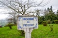 Blue sign Miradoiro do Pico Longo, Viewpoint Pico Longo in English, on typical Portuguese tiles. Grass and trees without