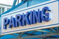 Blue sign over the parking Parking volumetric letters Royalty Free Stock Photo