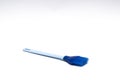 Blue silicone brush in a white background