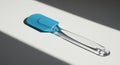 Blue Silicone Spatula with Transparent Handle, Dramatic Light and Shadow Royalty Free Stock Photo