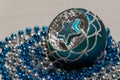 Blue Silver Christmas ball with star and beads Royalty Free Stock Photo