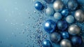 Blue and Silver Christmas Balls and Confetti on a Blue Background Royalty Free Stock Photo