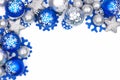 Blue and silver Christmas ornament corner border over white Royalty Free Stock Photo