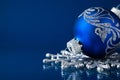 Blue and silver christmas ornaments on dark blue background Royalty Free Stock Photo