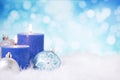 Blue and silver Christmas scene with baubles and candles Royalty Free Stock Photo