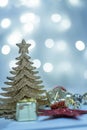 Blue silver Christmas tree and balls on the background of blue bokeh lights, Christmas card Royalty Free Stock Photo