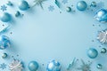Blue and silver ornaments frame on light blue background, top view with copy space Royalty Free Stock Photo