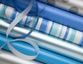 Blue, silver and while wrapping paper gift wrap and ribbons for Hanukkah holiday gifts presents Royalty Free Stock Photo