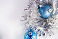 Blue and silver xmas ornaments on bright holiday background with space for text. Merry christmas! Christmas balls. Royalty Free Stock Photo