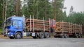 Blue Sisu Polar Timber Truck with Trailers Full of Spruce Logs