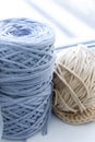 The blue skein and the skein of beige are at the window Royalty Free Stock Photo